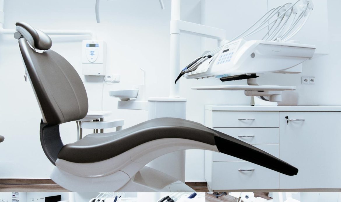 A modern dental clinic interior showcasing a dental chair and equipment in a clean, clinical setting.