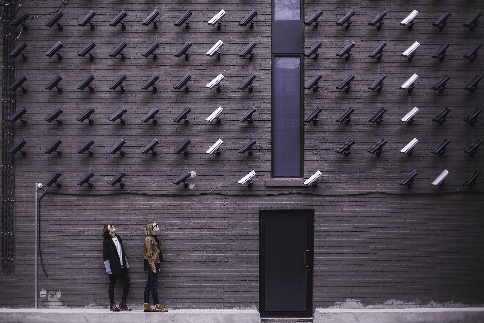Operators watching live camera monitoring wall