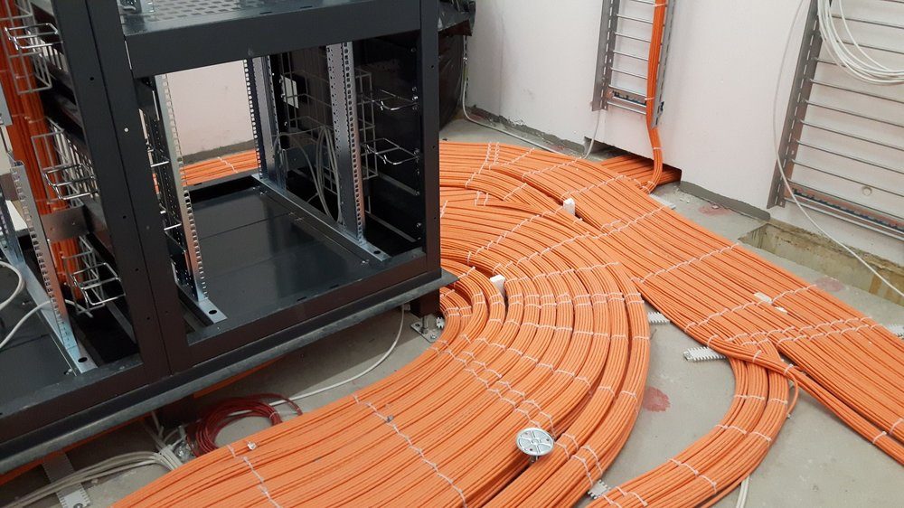Cable bundles arriving at a rack during rough-in