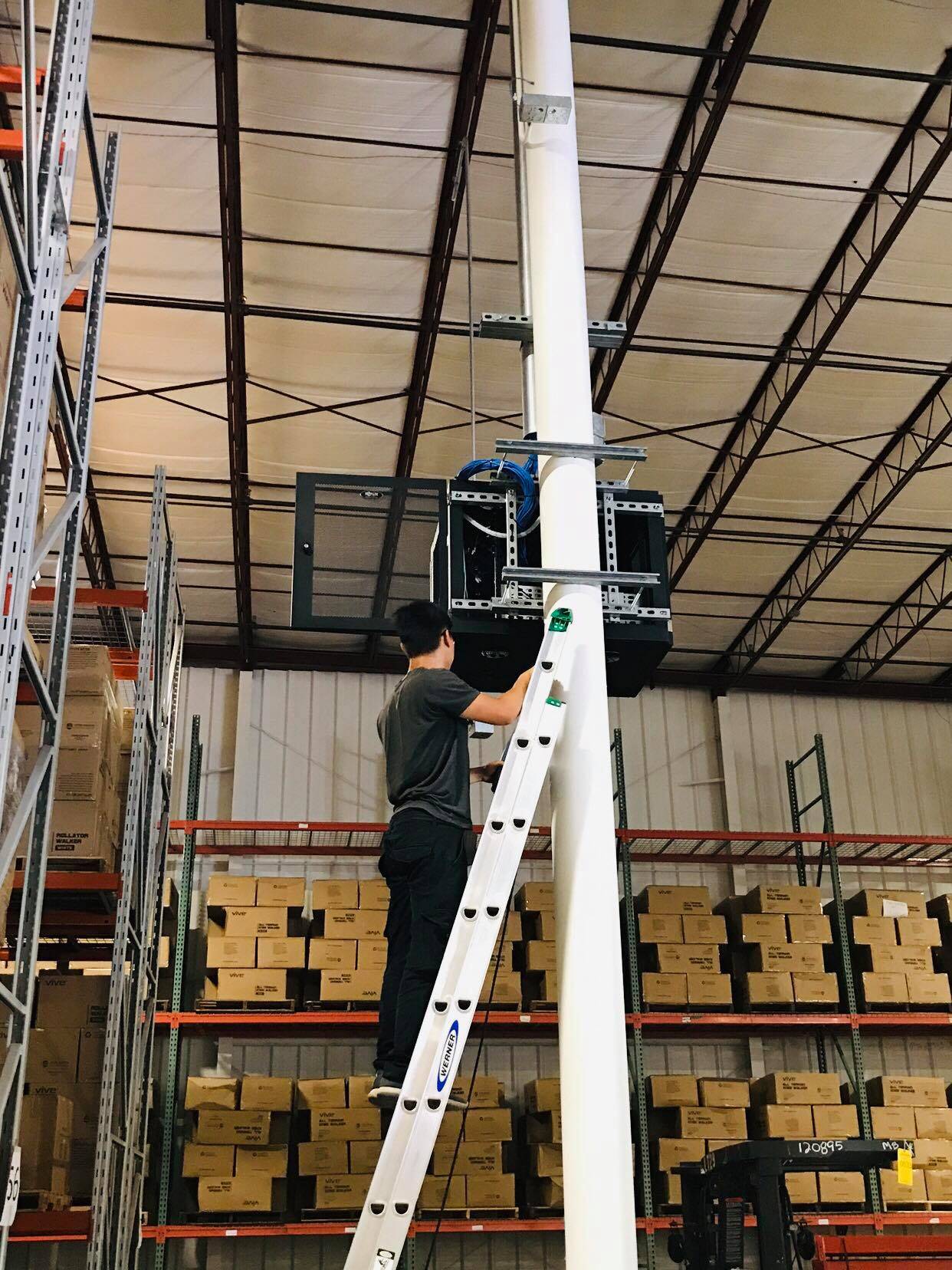 Column-mounted low voltage equipment in a warehouse