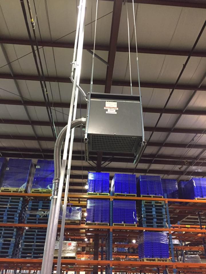 Speaker and cabling install from a lift in a high-bay warehouse