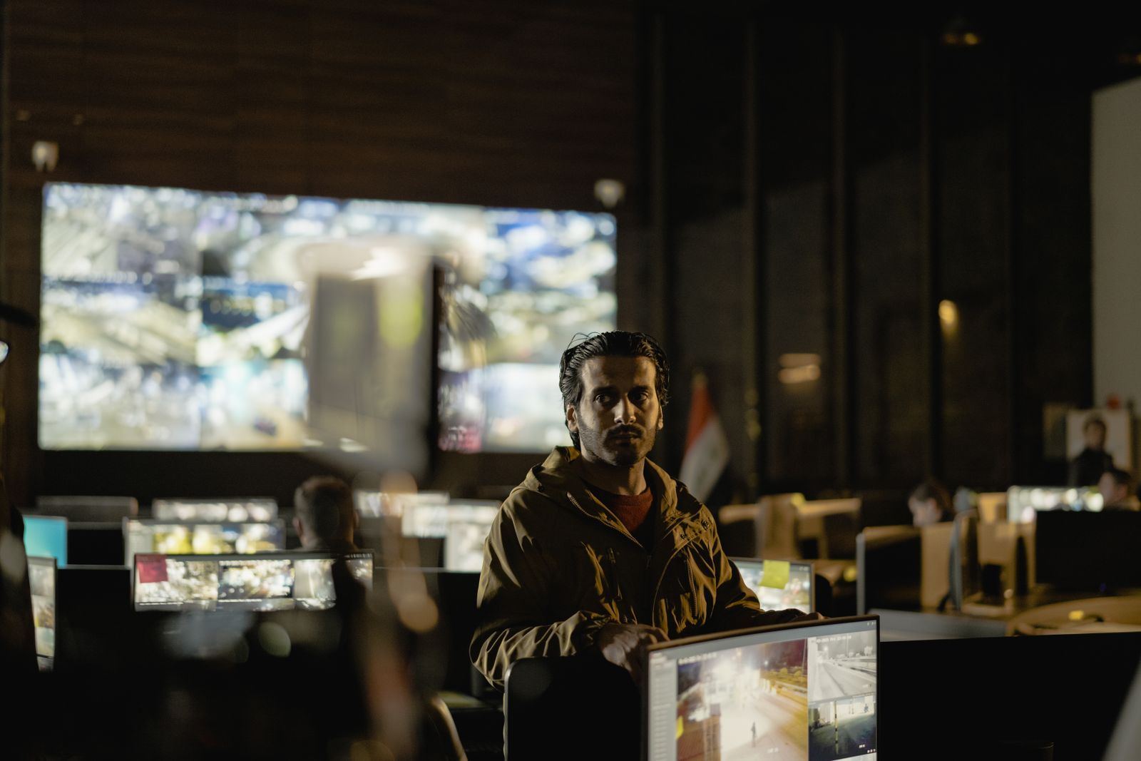 Operators watching a live camera monitoring wall